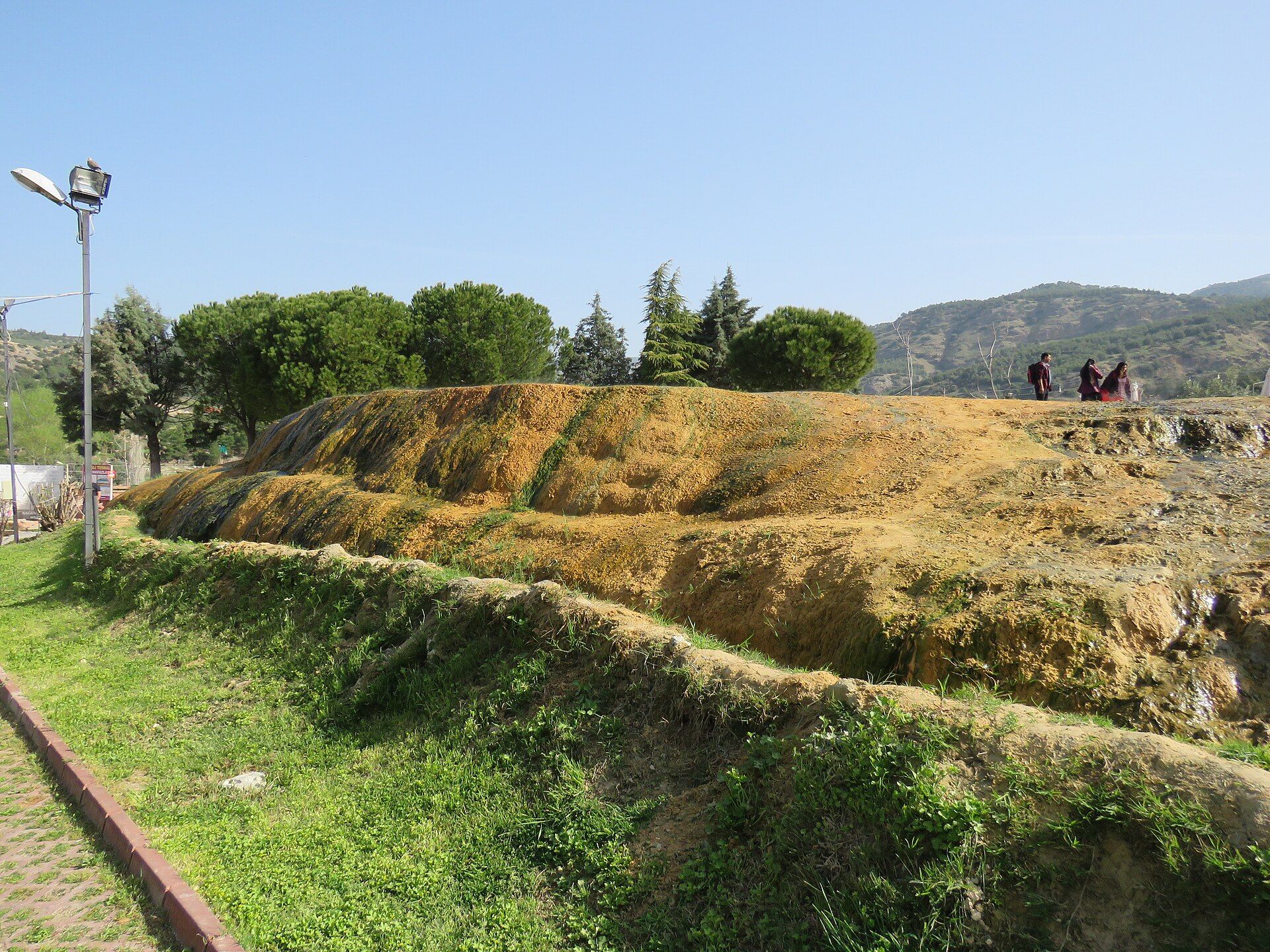 Rust-red thermal deposits at Karahayıt's Kırmızı Su springs near Pamukkale
