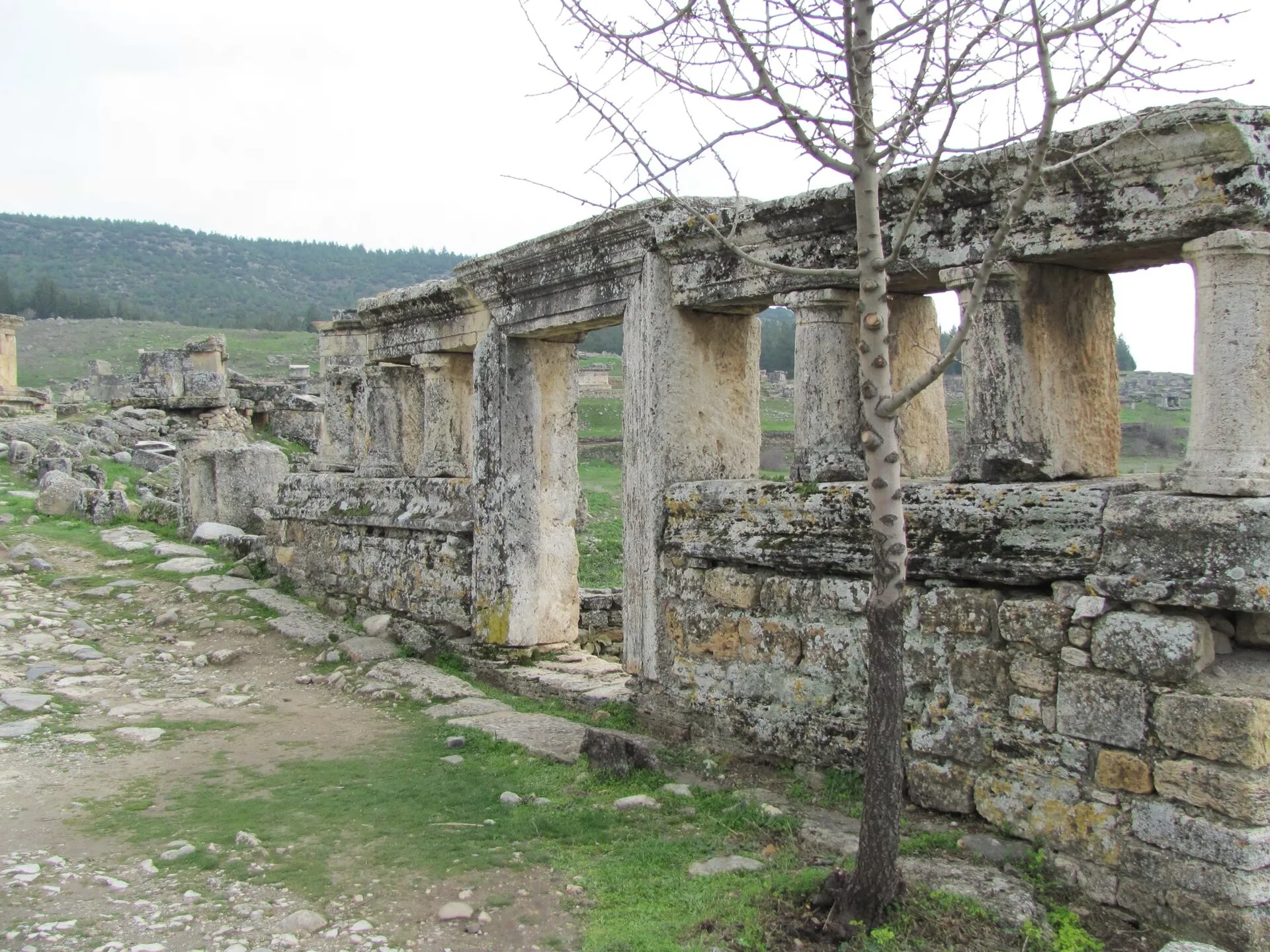 The ancient ruins of Hierapolis on the plateau above the Pamukkale terraces under midday sun