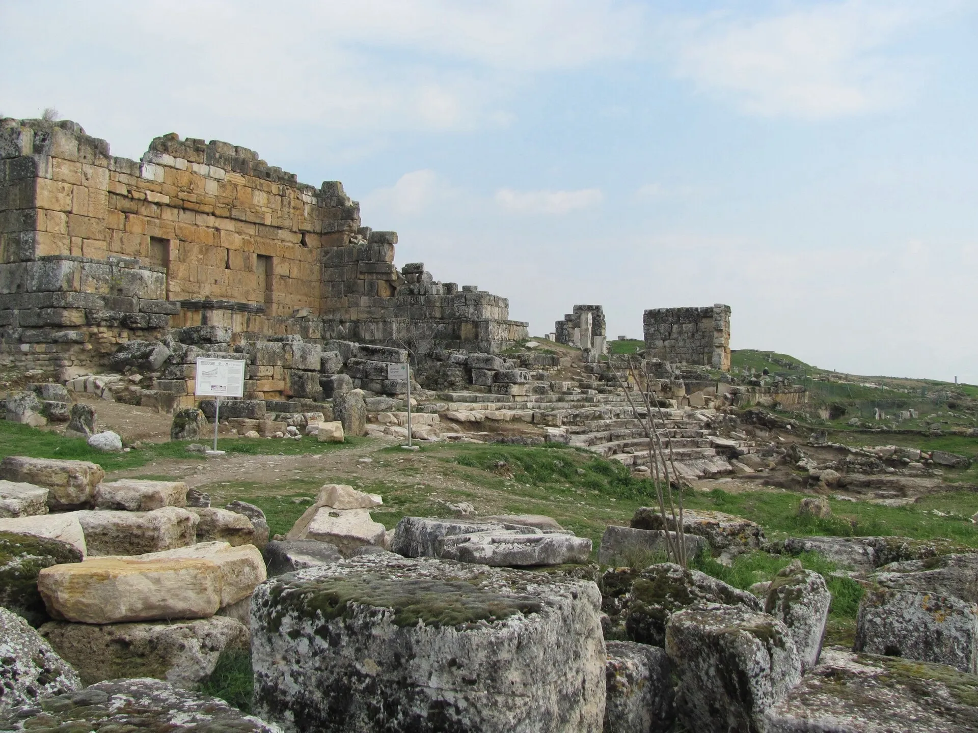 Ancient ruins of Hierapolis above the white travertine terraces of Pamukkale