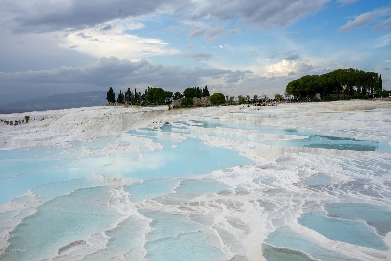 The white travertine terraces and turquoise thermal pools of Pamukkale